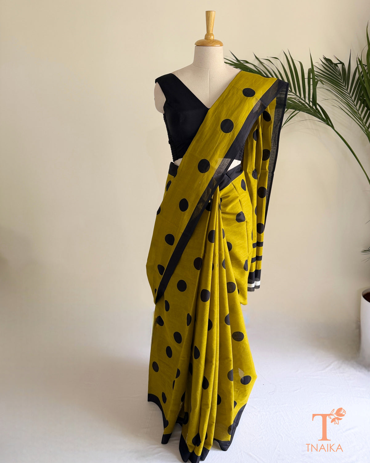 Lightweight cotton polka dot saree featuring delicate dots in soft, soothing tones