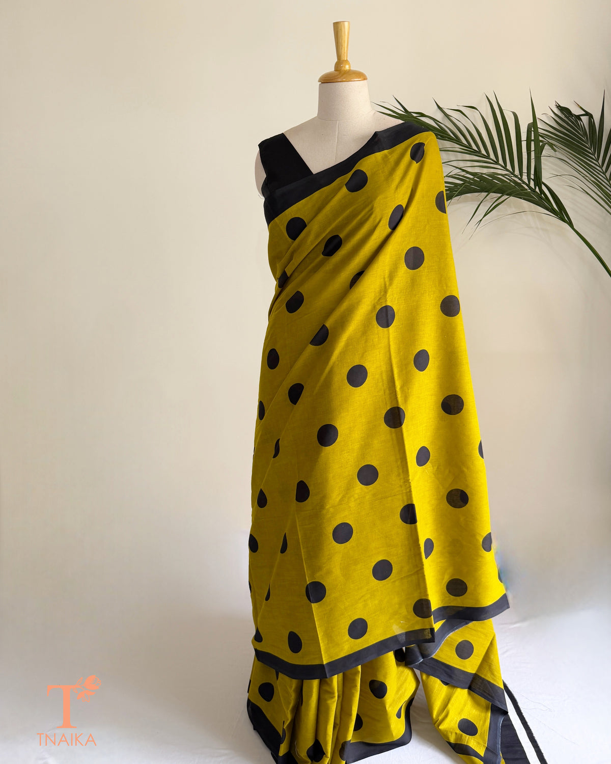 Soft cotton saree with polka dot print in soothing shades and a lightweight drape