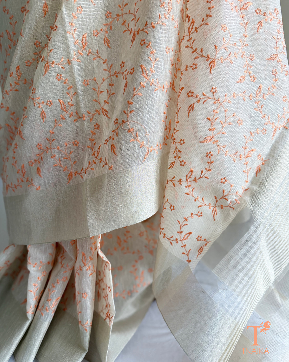 Embroidered ivory saree with striped pallu detailing