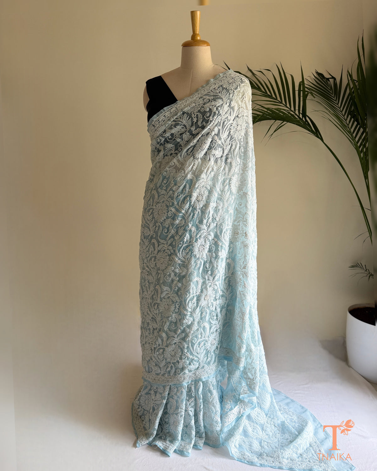 Full jaal Chikankari saree with intricate Lucknowi embroidery on soft fabric.