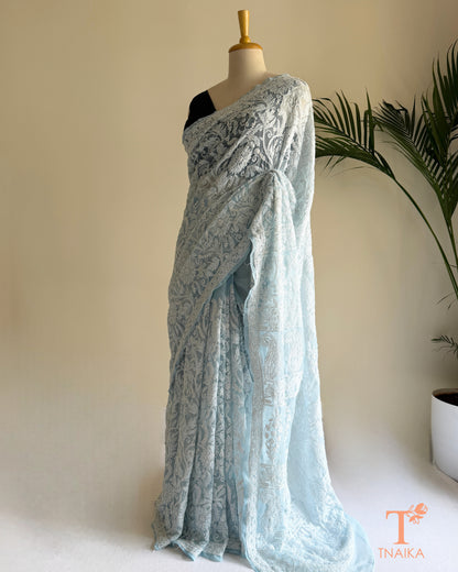 Premium Chikankari full jaal saree featuring dense traditional embroidery.