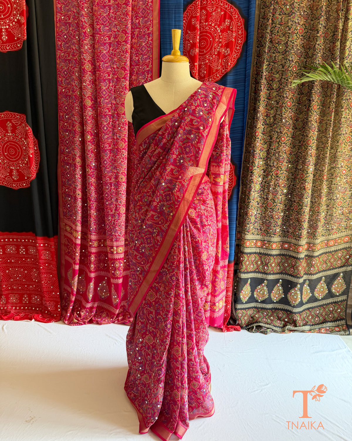 Marshmallow saree featuring intricate motifs and mirror detailing