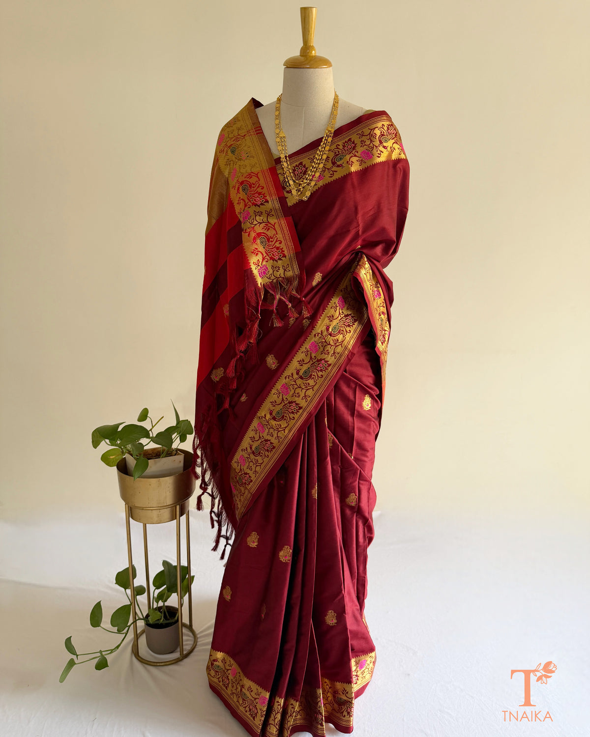 Traditional Paithani-style saree with zari butti motifs
