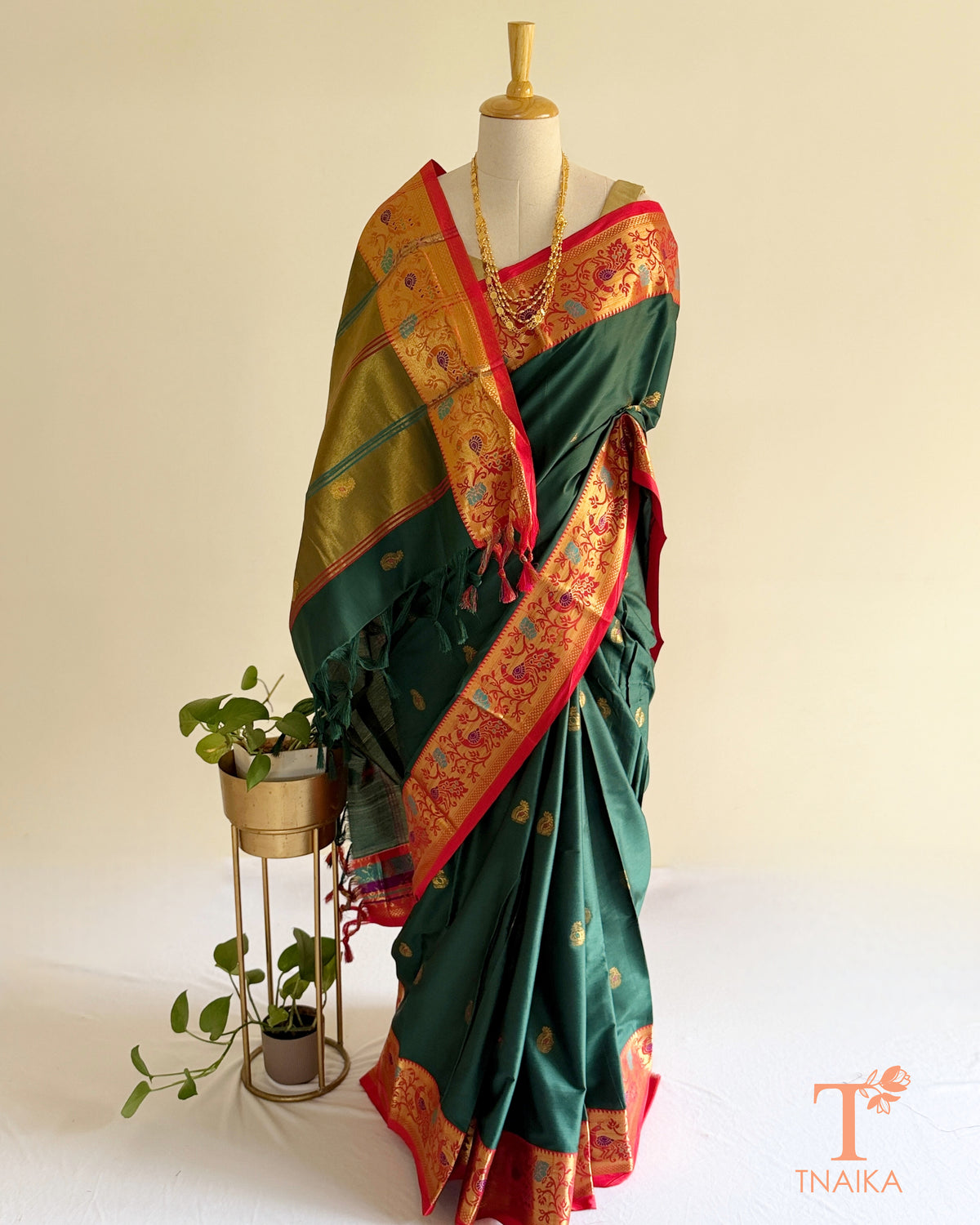 Traditional Paithani-style saree with zari butti motifs