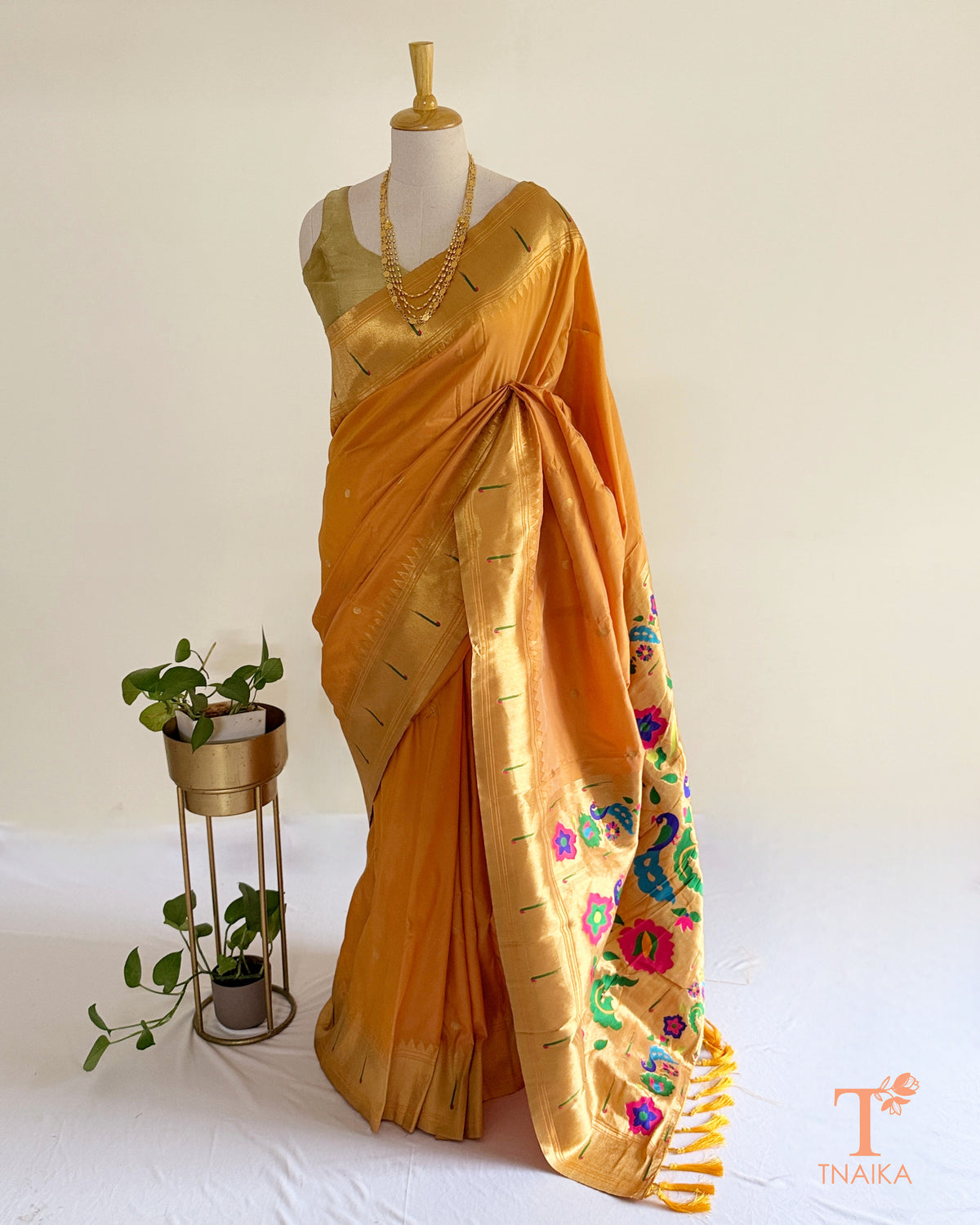 Semi silk saree featuring decorative Paithani-style pallu