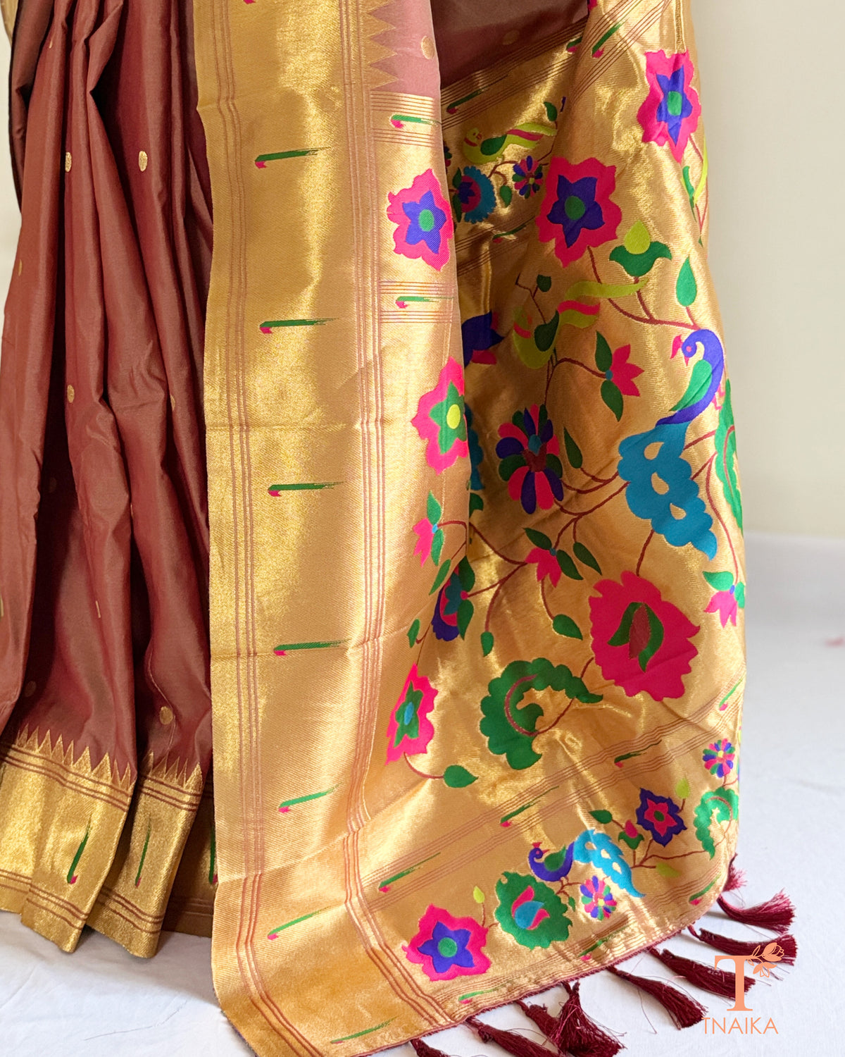 Semi silk saree featuring decorative Paithani-style pallu