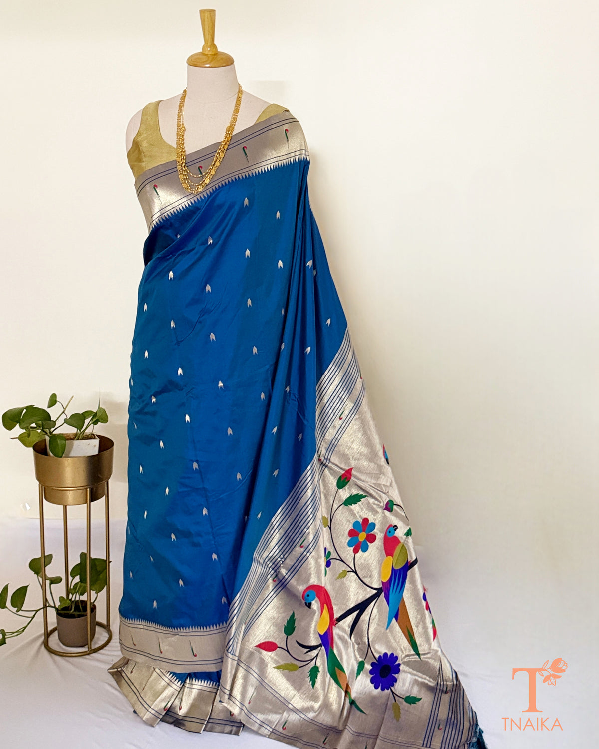 Semi silk saree featuring decorative Paithani-style pallu