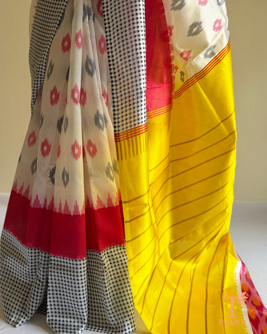 Satin silk saree with tribal-inspired prints, striped design, and bold navy teal border detailing