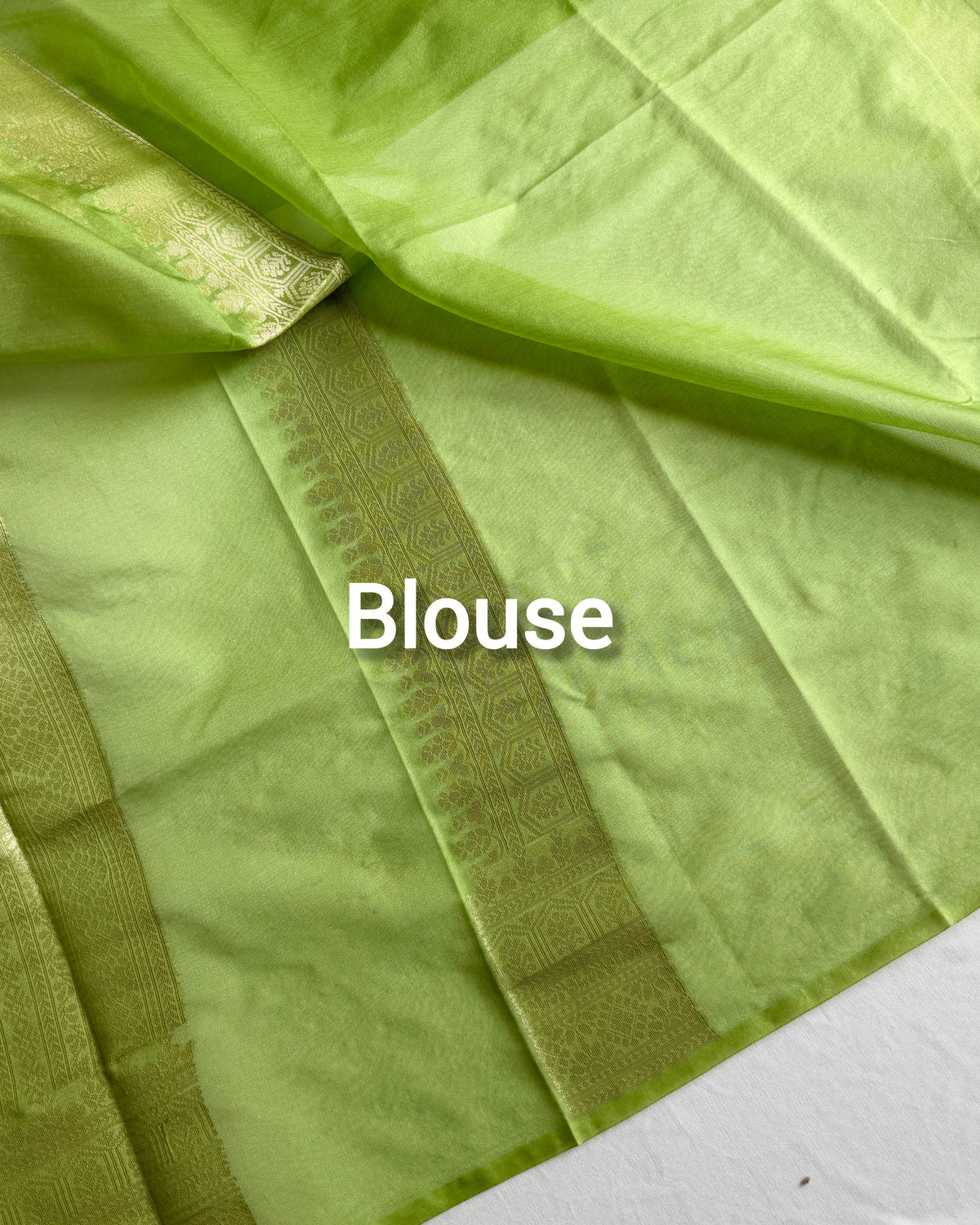 Banarasi silk organza saree with colourful Meenakari detailing