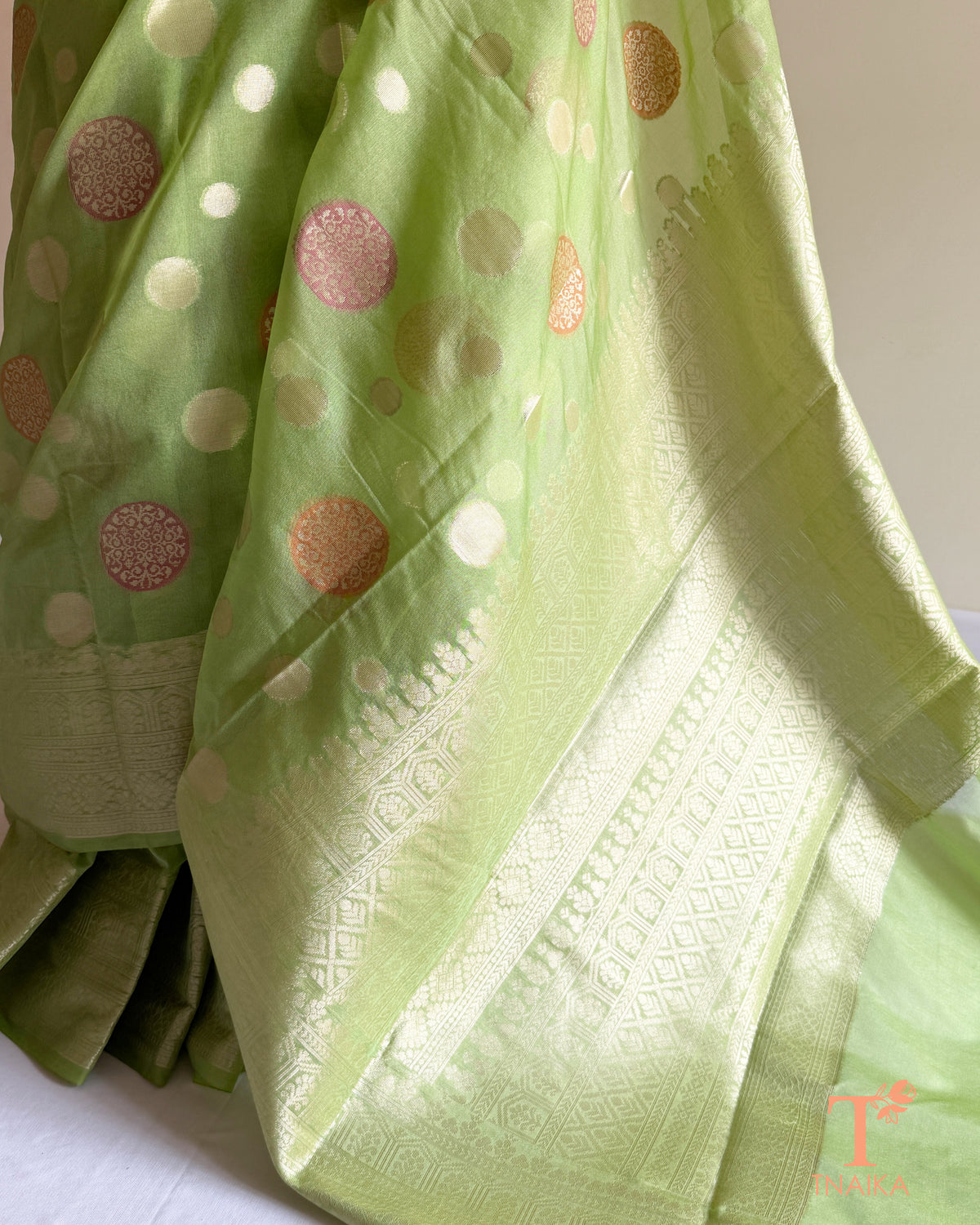 Designer organza saree featuring traditional Banarasi boota patterns