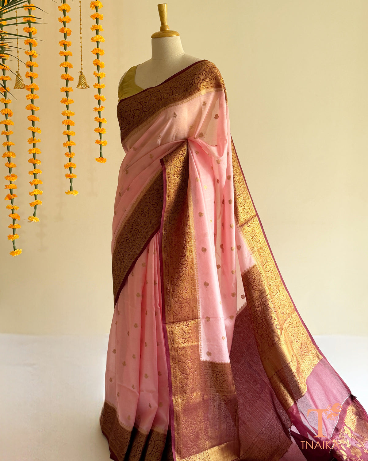 Tnaika semi Banarasi silk saree in blush pink with golden butti motifs