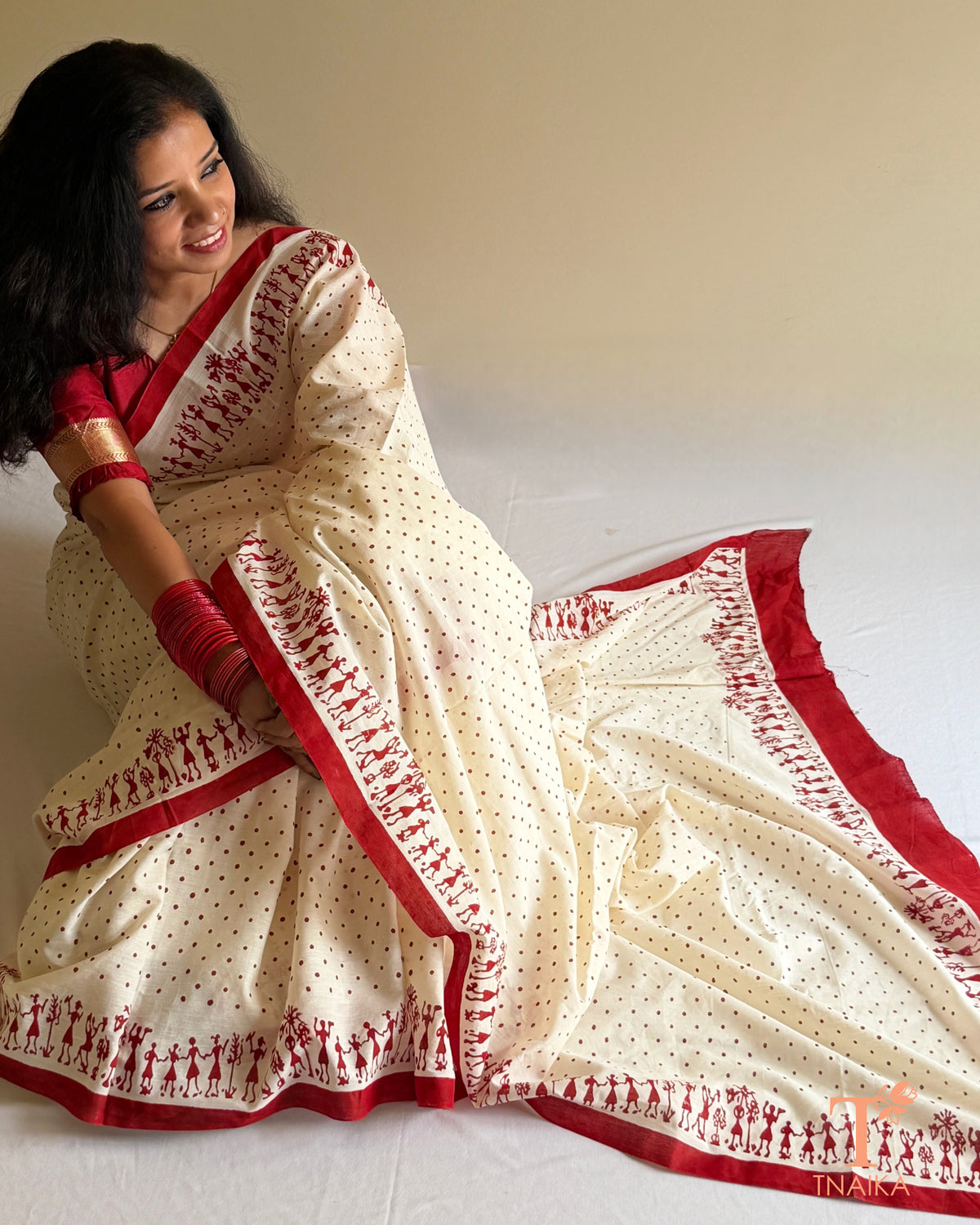 Pure Mul cotton saree with polka dot print and Warli art border