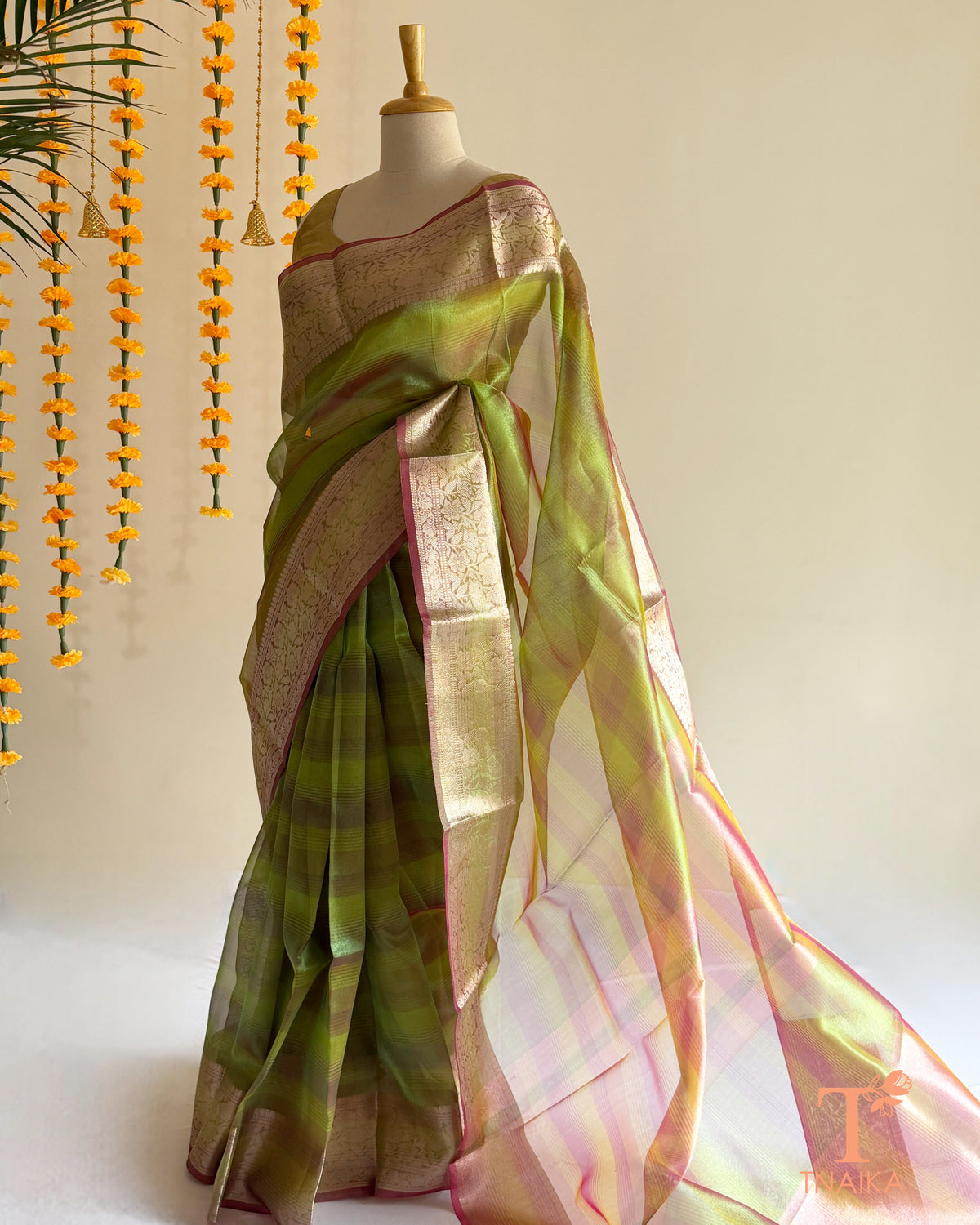 Tissue silk saree with subtle sheen and graceful drape