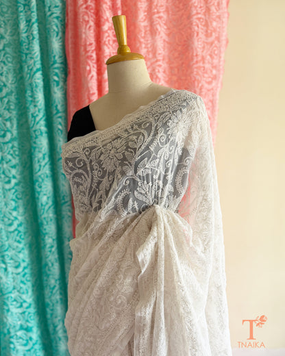 Handcrafted Chikankari saree adorned with detailed white thread embroidery and an embroidered pallu.