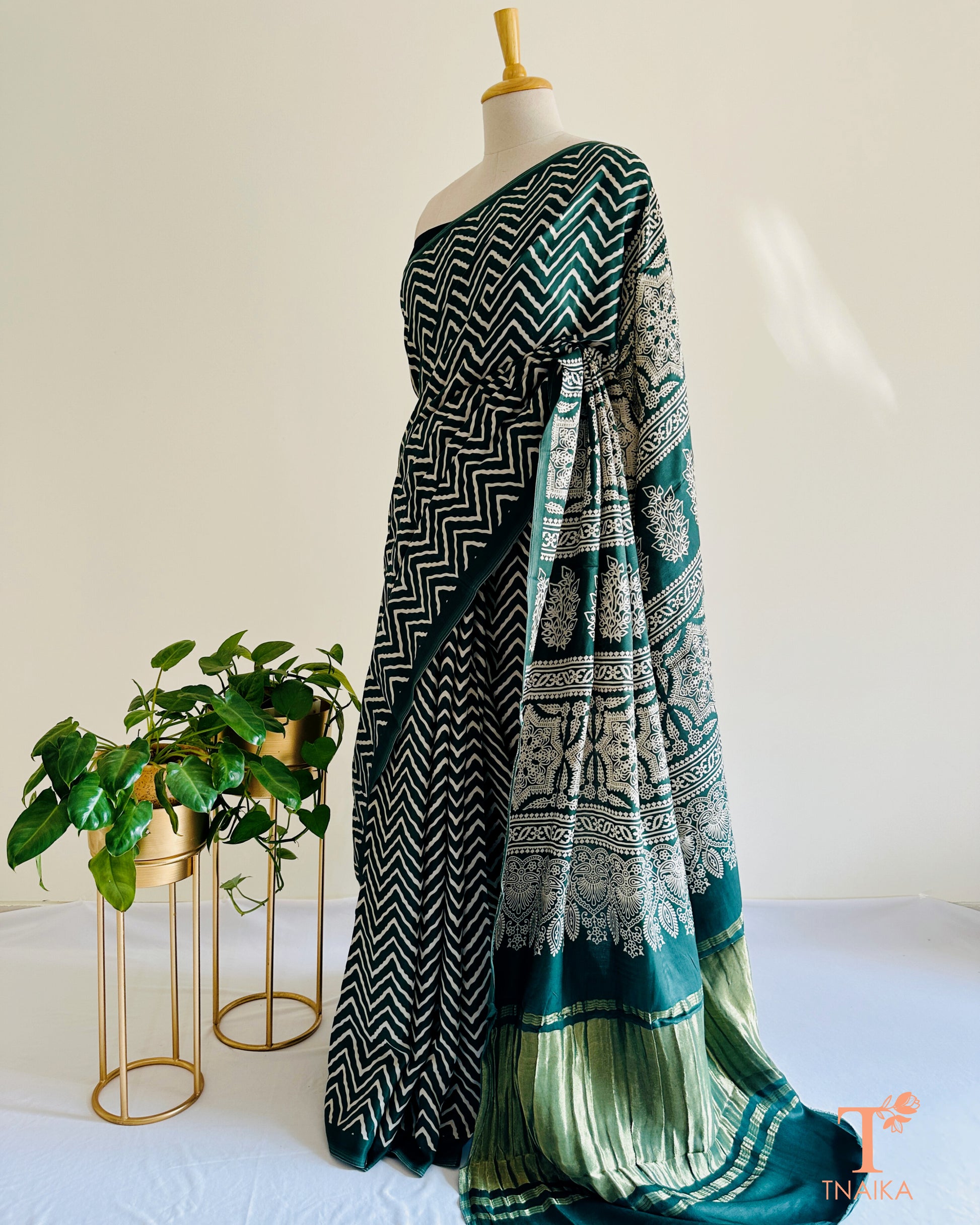 Elegant daytime modal silk leheriya saree with shiny tissue pallu and bold Ajrakh work, with unstitched bandhani printed blouse piece.