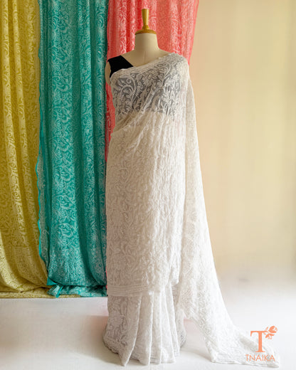 Chikankari saree with intricate white Lucknowi hand embroidery and elegant floral vine patterns.