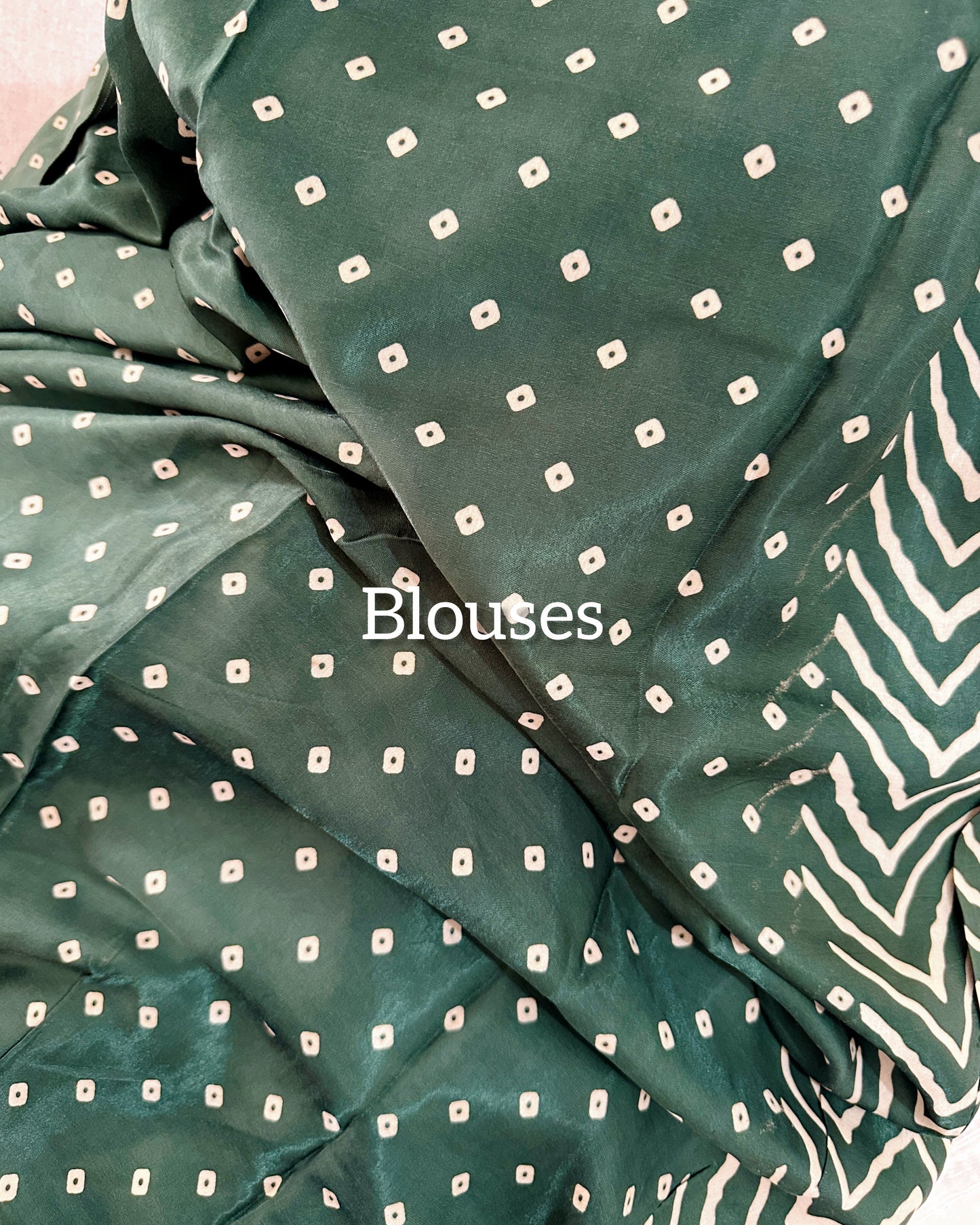 Vibrant leheriya print modal silk saree featuring shimmering tissue pallu with Ajrakh design and matching bandhani print blouse piece.