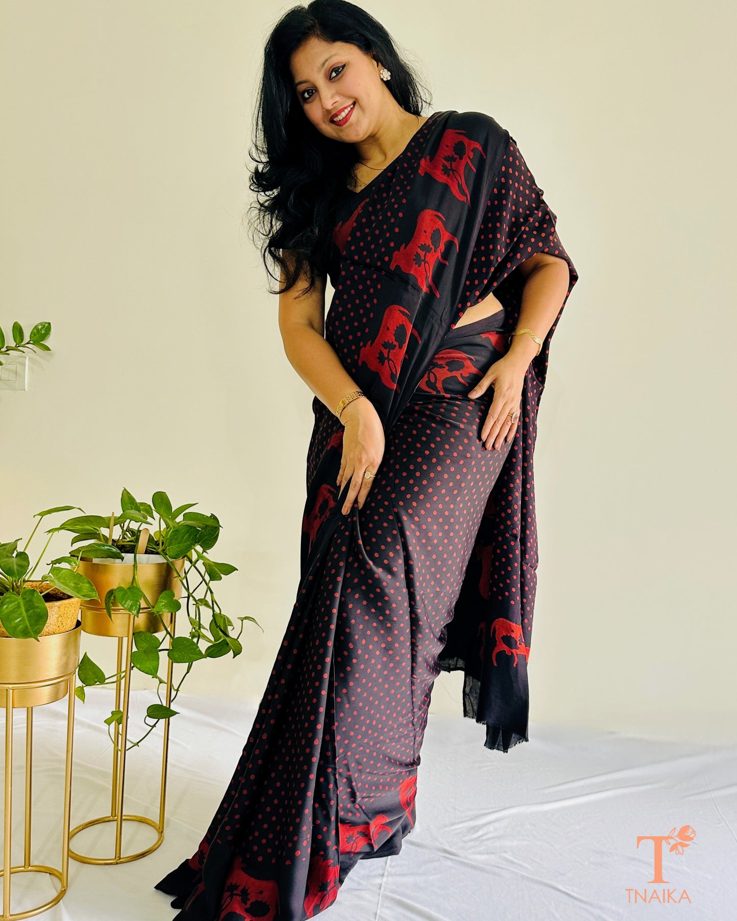 Heritage-inspired modal silk saree with symbolic cow border