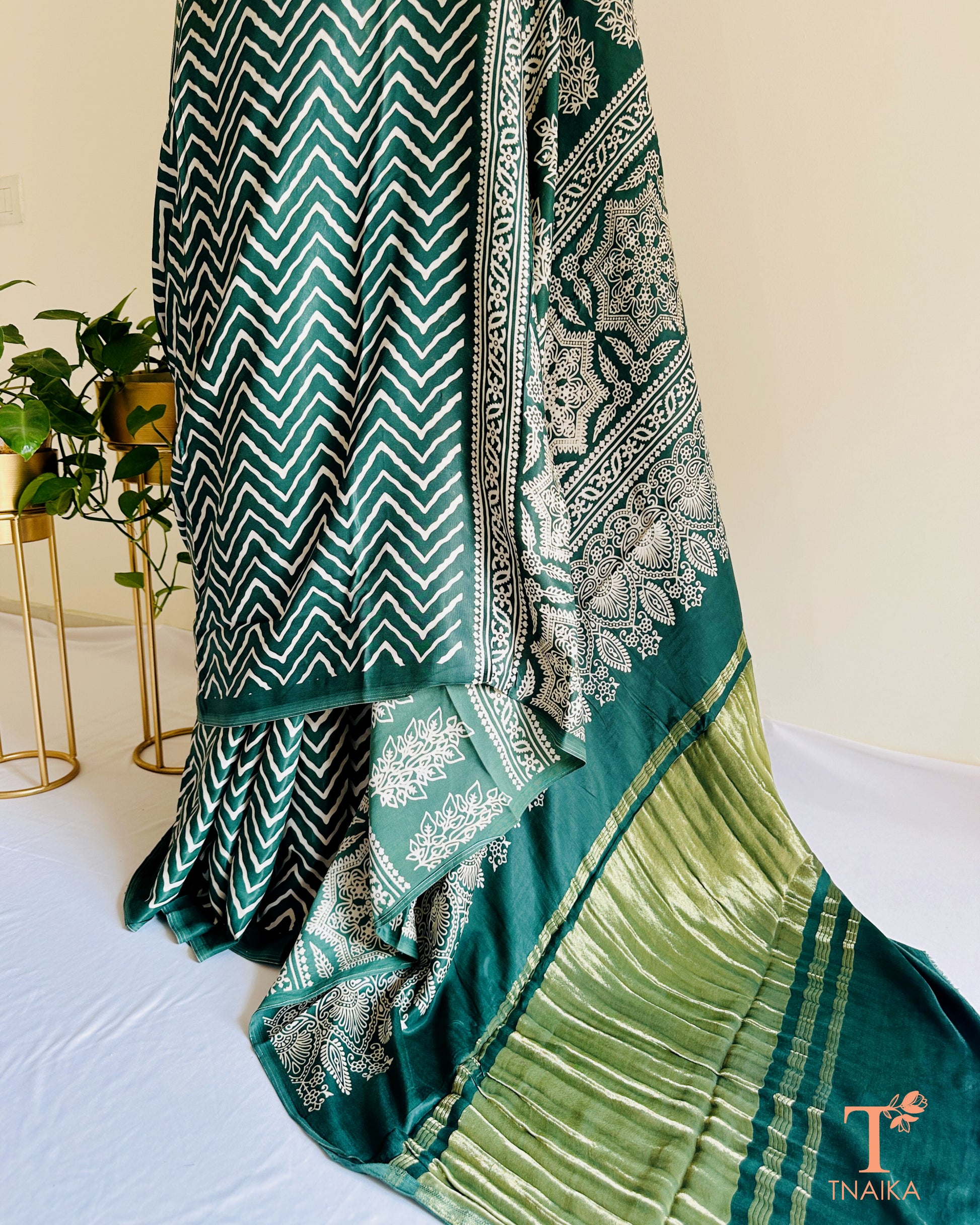 Elegant daytime modal silk leheriya saree with shiny tissue pallu and bold Ajrakh work, with unstitched bandhani printed blouse piece.