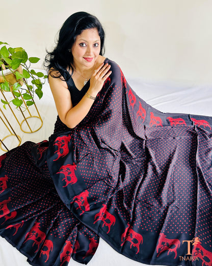 Traditional Indian cow motif saree in black and red tones