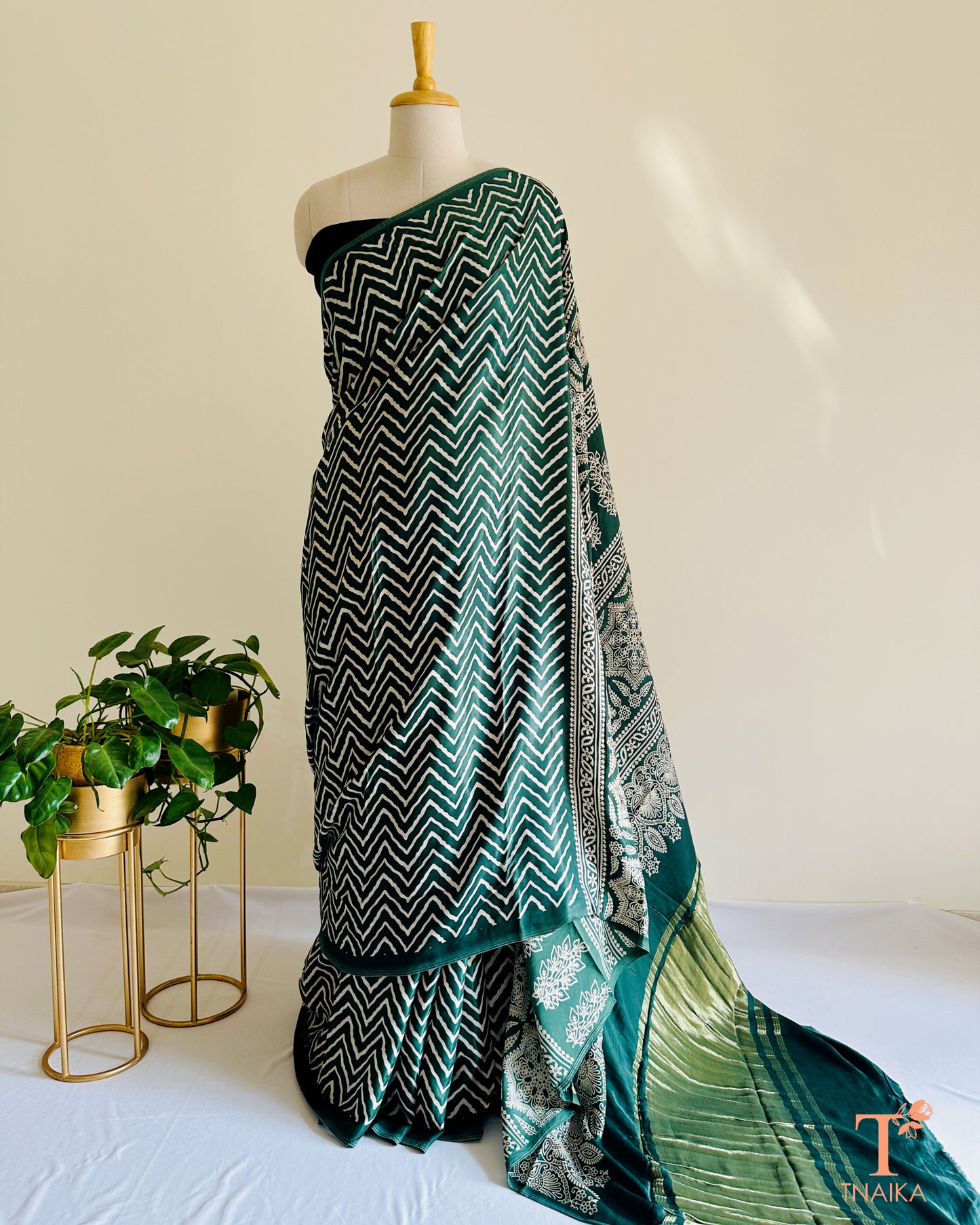 Festive modal silk saree with classic leheriya pattern, tissue lagadi patta-style pallu and Ajrakh accents, includes bandhani running blouse.