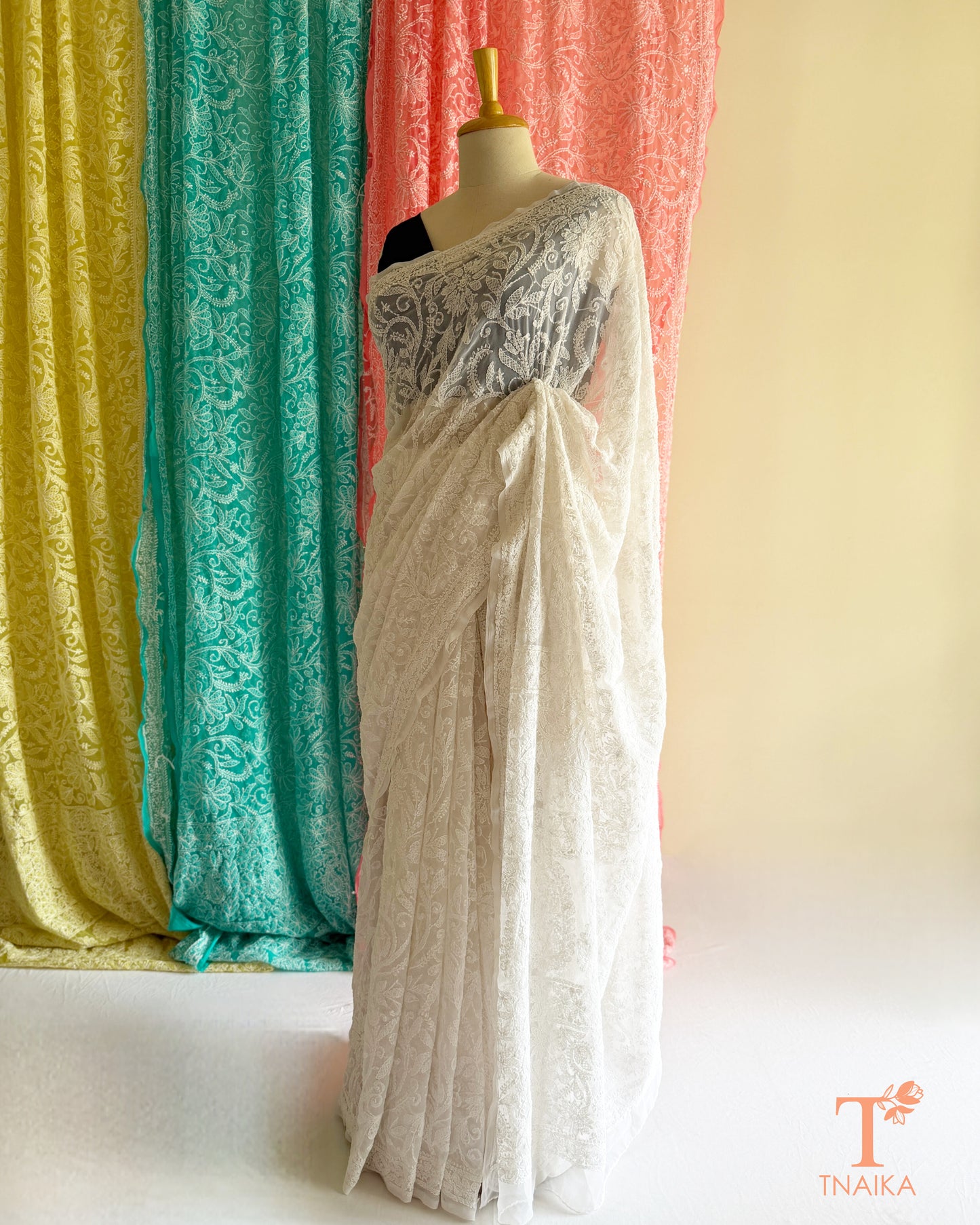Premium Lucknowi Chikankari saree featuring handcrafted white thread embroidery and richly embroidered pallu.