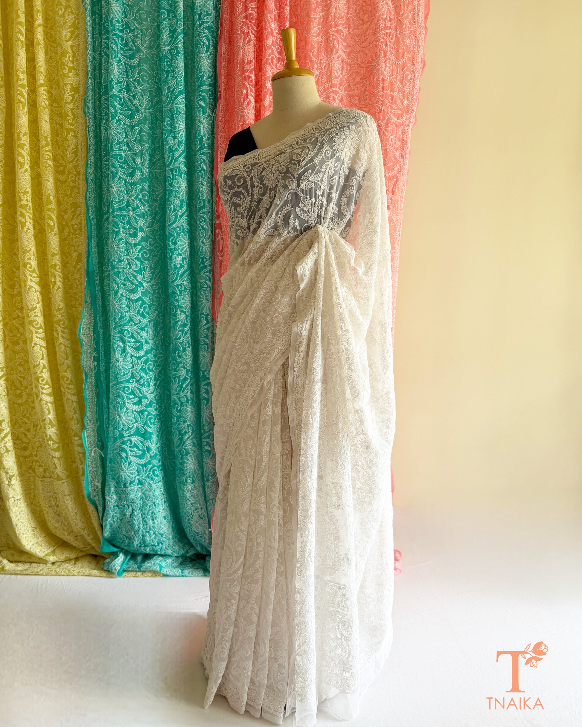 Premium Lucknowi Chikankari saree featuring handcrafted white thread embroidery and richly embroidered pallu.