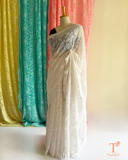 Premium Lucknowi Chikankari saree featuring handcrafted white thread embroidery and richly embroidered pallu.